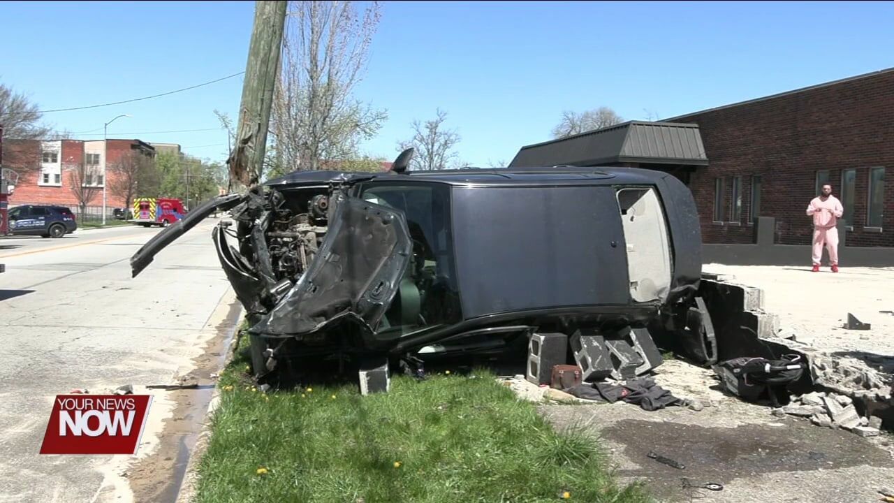 Woman injured after car crashes into utility pole on Main Street